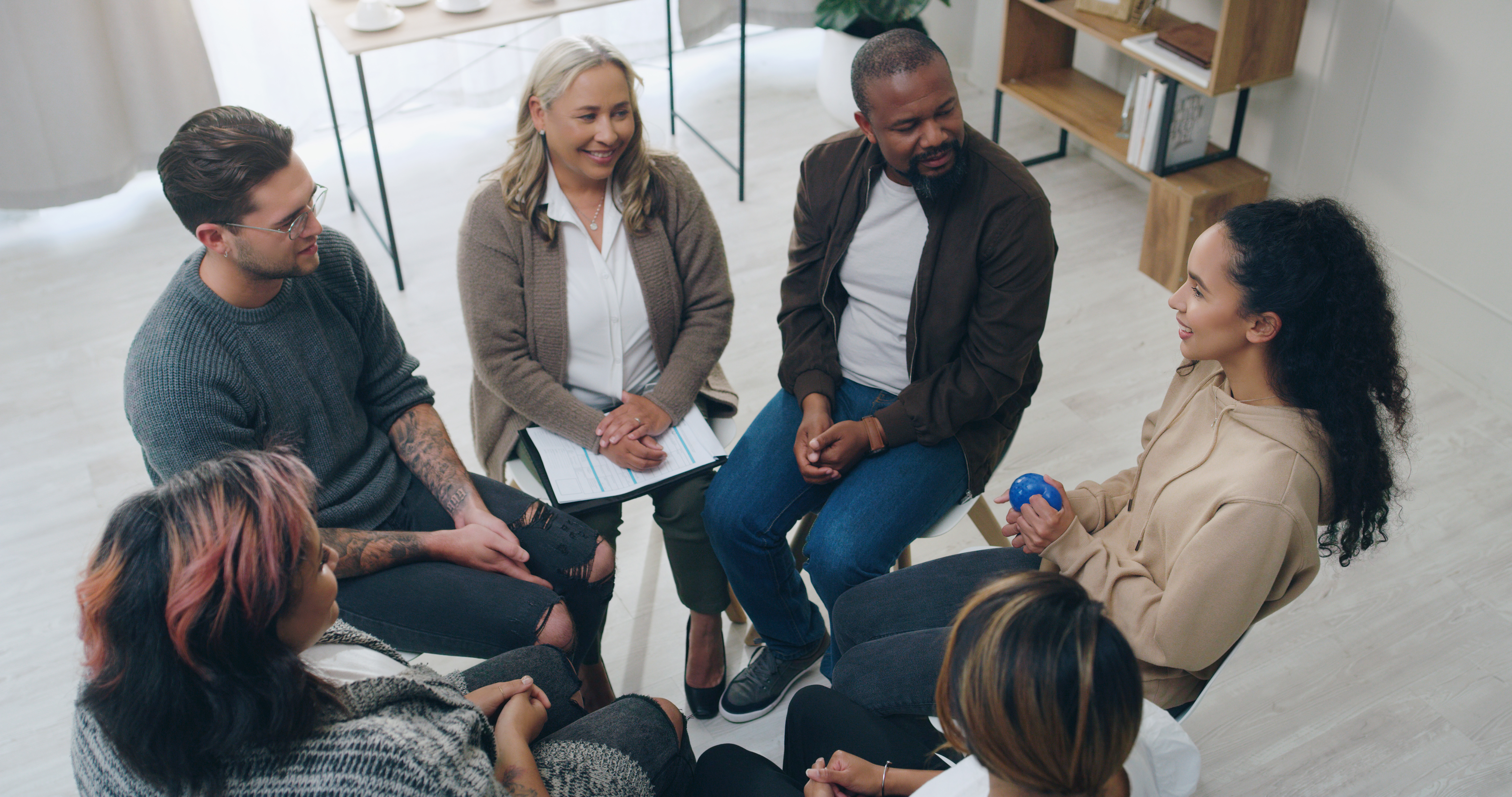 Team building, therapy group and people in circle for mental health support, communication and coun.